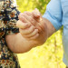 a woman and a man holding hands