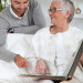 Mom looking at photo album with son