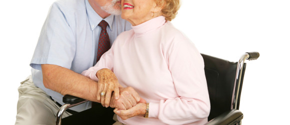 Affectionate senior husband giving his wife a kiss on the cheek.