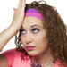 Girl dressed from the 80's poses like she forgot something