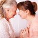 Senior woman with her caregiver at home
